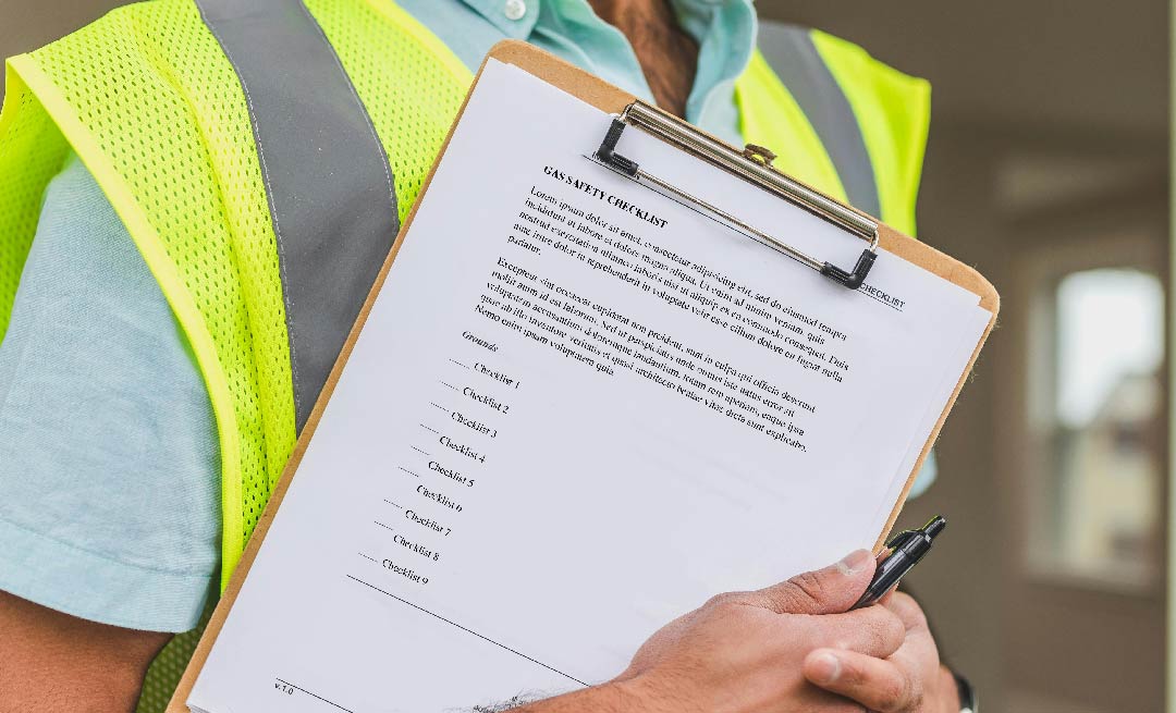 A worker with a checklist on a clipboard